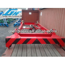 Semi-automatic container lift spreader for loading bulk material
